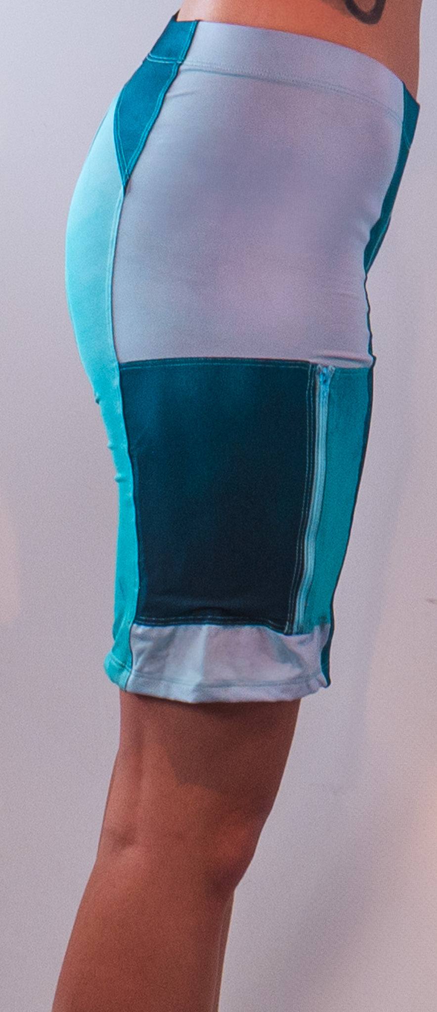Women's mountain bike shorts with built-in Italian chamois, featuring side zipper pocket and moisture-wicking fabric.